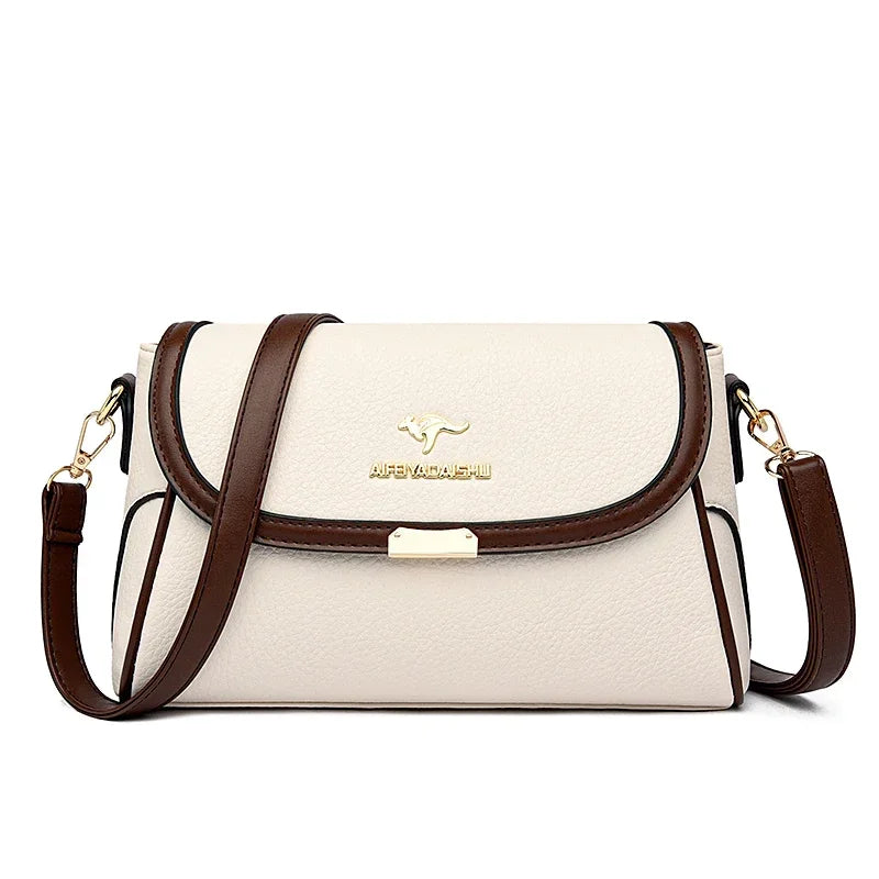 White handbag with brown accents and a visible brand logo on a white background