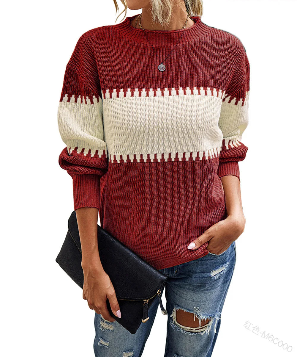 A woman wearing a ribbed knit sweater with a red and cream horizontal stripe pattern, paired with distressed blue jeans and holding a black clutch bag.