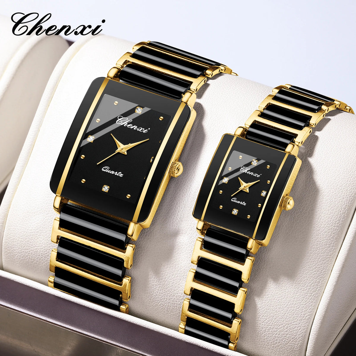 Two black and gold watches on a white cushion with 'Chenxi' branding.