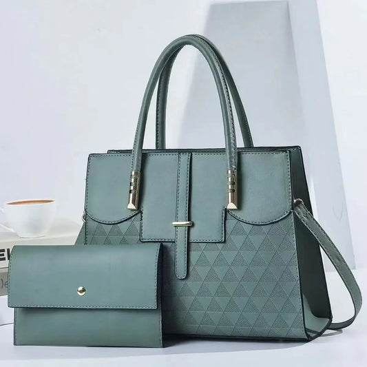 Green handbag with a matching wallet on a white background