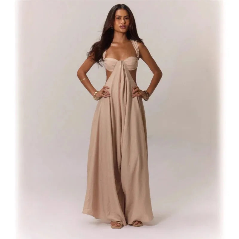 Woman wearing a beige evening gown on a plain background