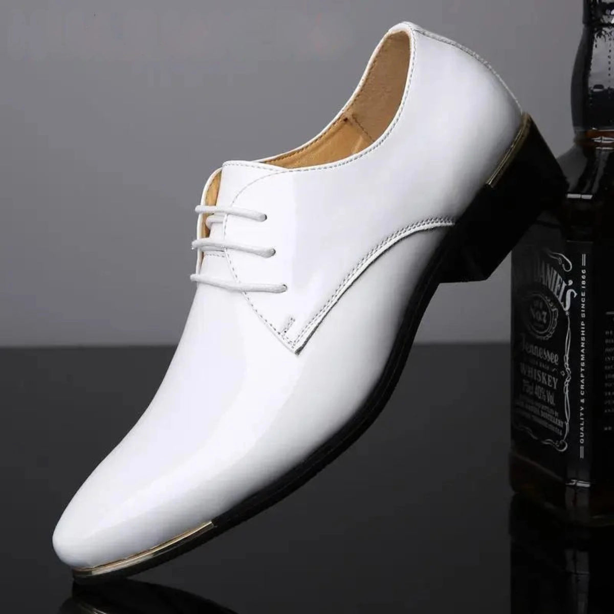 White leather shoe on a dark background