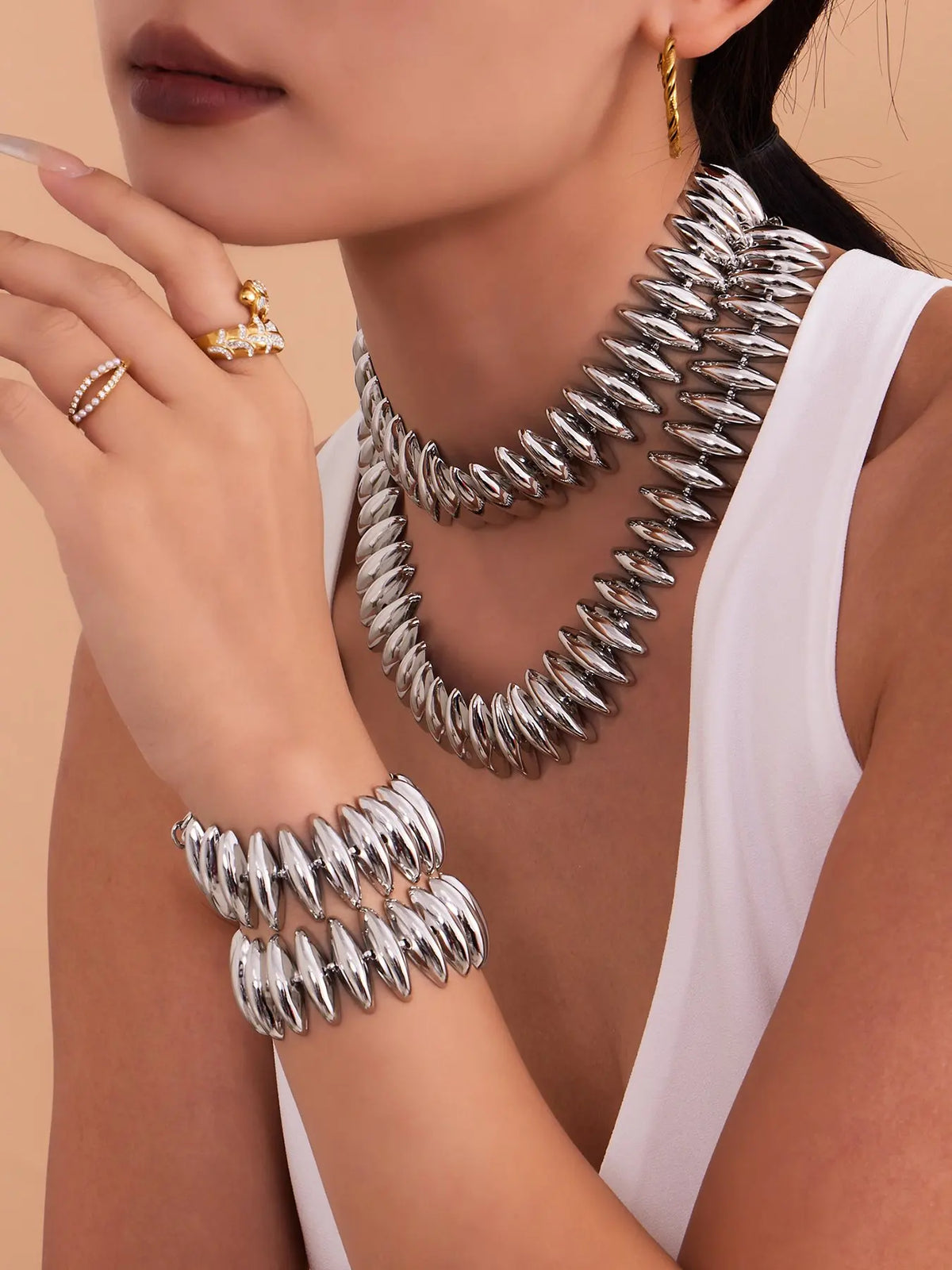 Sculptural Gold Beaded Jewelry Collection