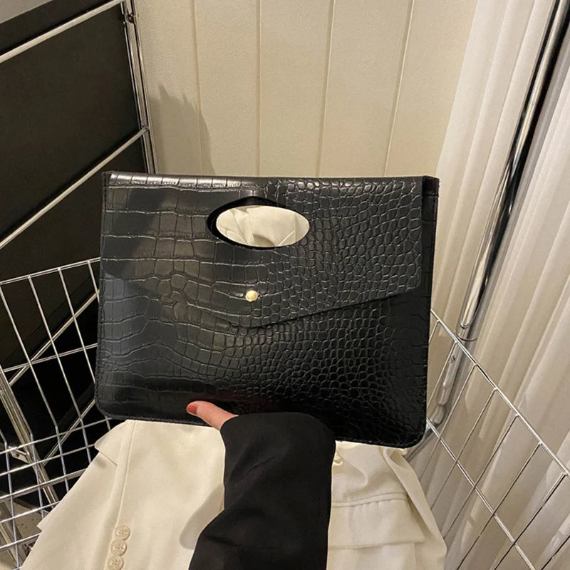 Black Bold Envelope Evening Clutch with crocodile-textured PU exterior, flap and cutout handle.