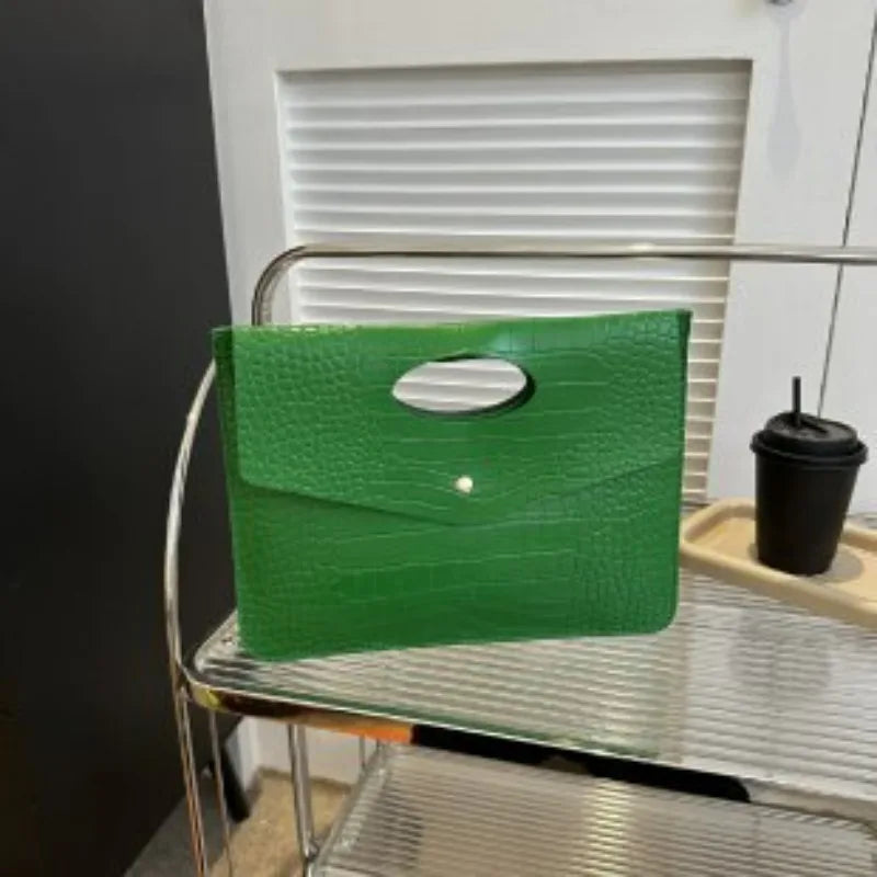 Green Bold Envelope Evening Clutch with crocodile-textured PU exterior and flat envelope silhouette.