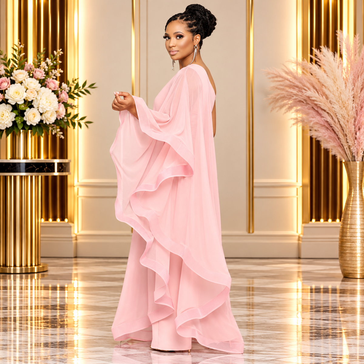 Elegant blush pink one-shoulder ruffle jumpsuit for women, featuring a flowing chiffon overlay, cascading ruffles, and wide-leg silhouette. Model showcases the side and back view in a luxurious gold-accented setting.