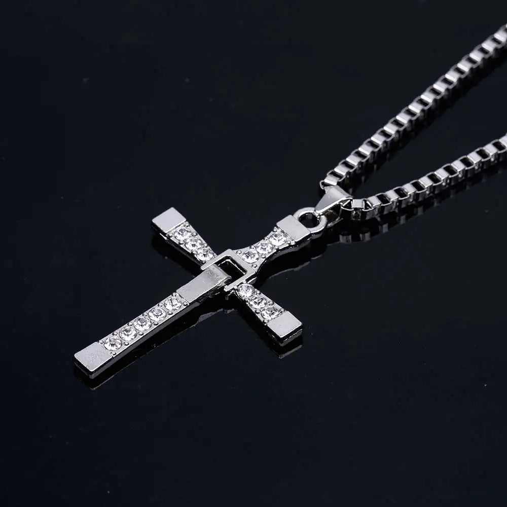 Close-up of crystal cross pendant showing detailed design and craftsmanship