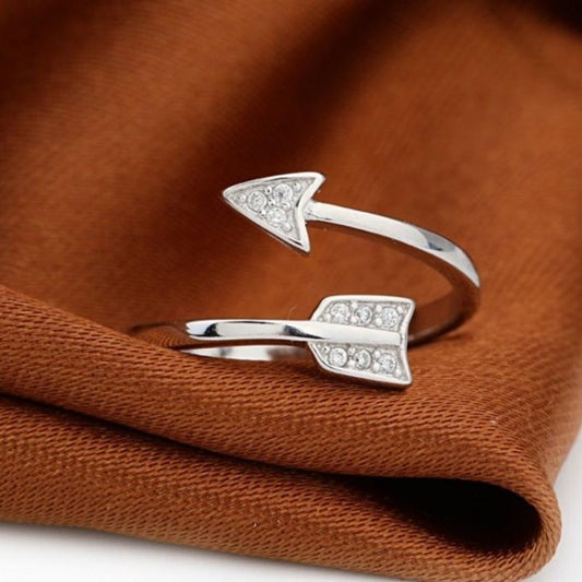 Adjustable arrow ring featuring delicate crystal details and silver finish
