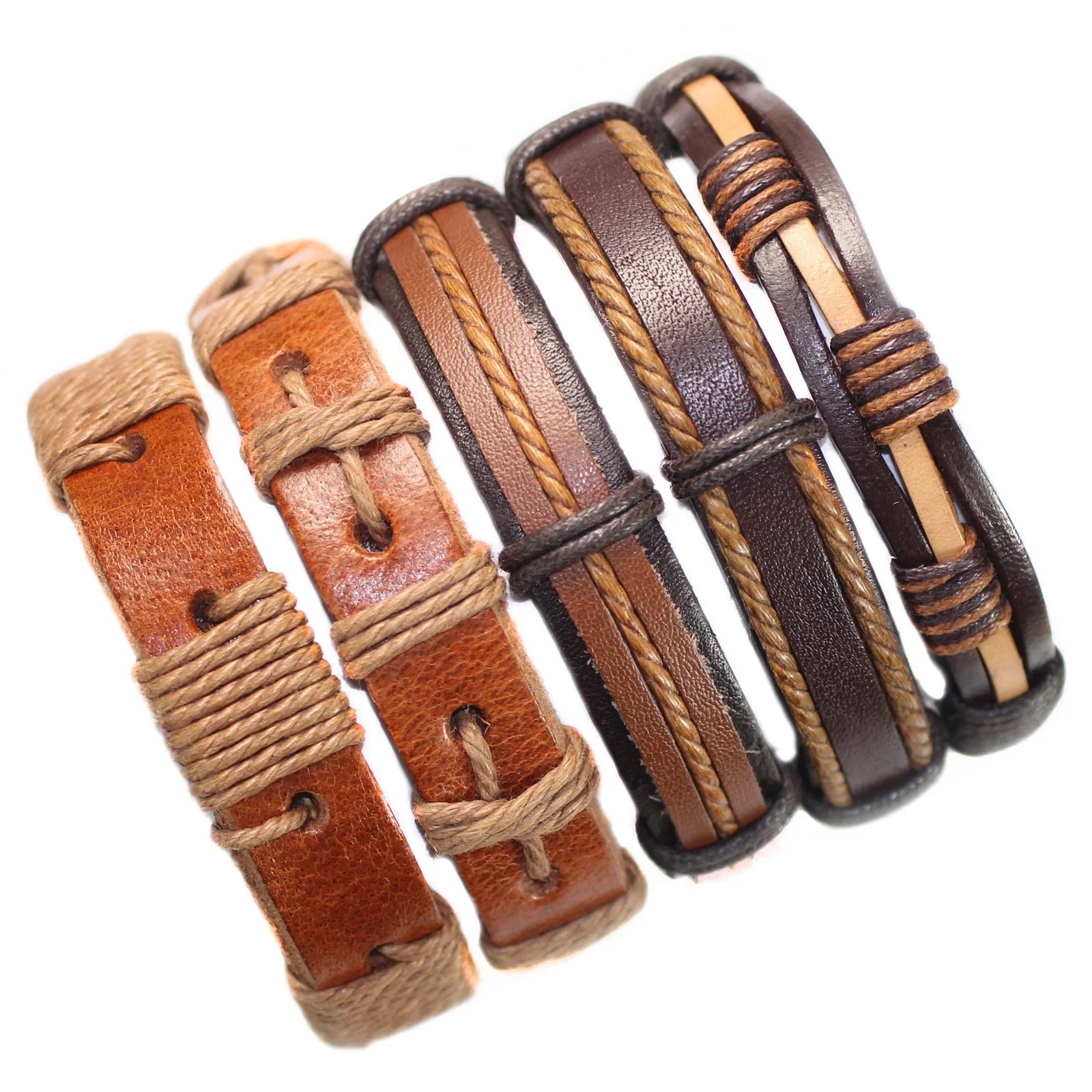 Set of leather bracelets with brown and black straps on a white background