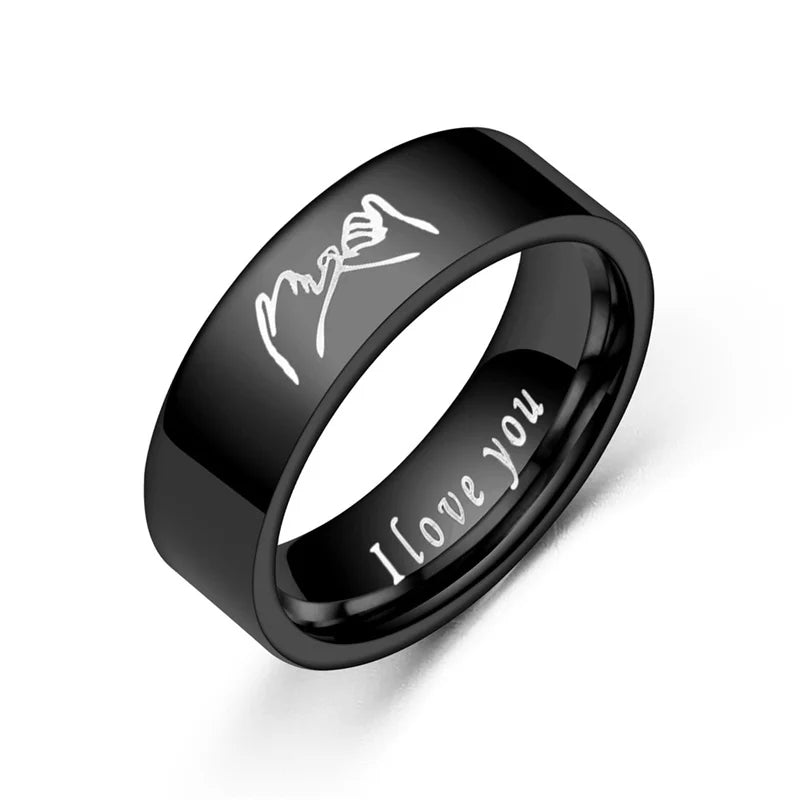Black ring with engraved 'I love you' and signature
