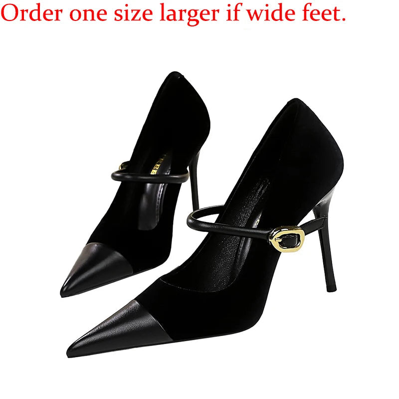 Black high-heeled shoes with a gold buckle on a white background, accompanied by text advising to order one size larger for wide feet.
