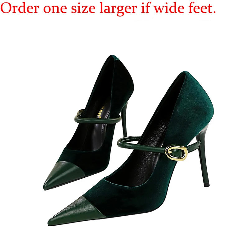 Green high-heeled shoes with a strap and buckle on a white background, with text advising to order one size larger for wide feet.