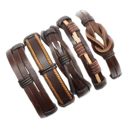 Set of brown leather bracelets with braided design on a white background