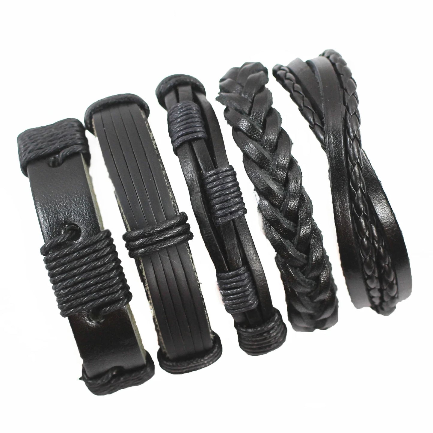 Set of black leather hair accessories with braided designs on a white background
