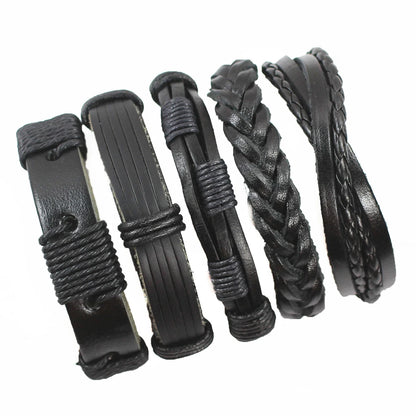 Set of black leather hair accessories with braided designs on a white background