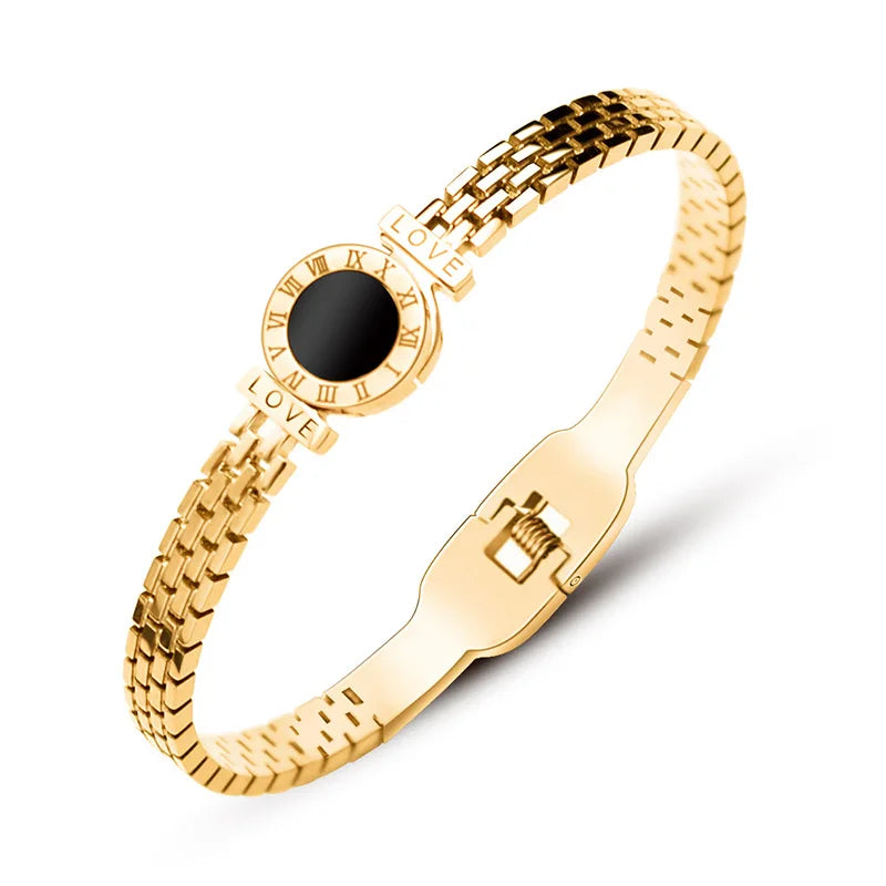 Gold bracelet with a black gemstone for an elegant background