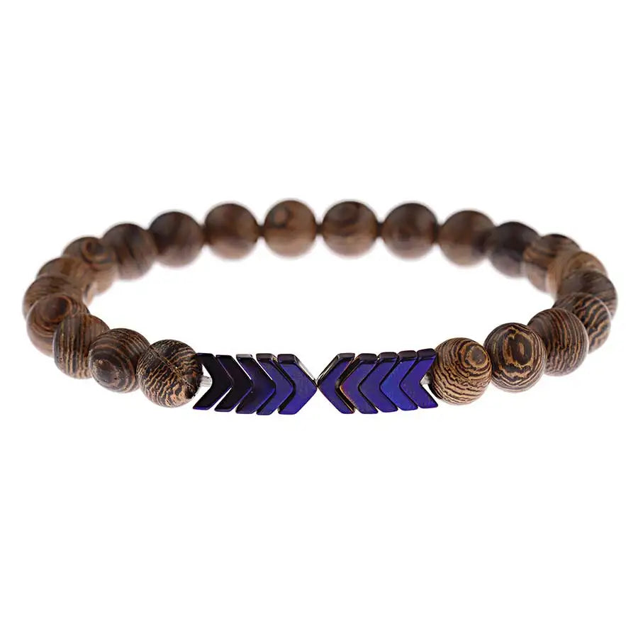 Wooden beaded bracelet with blue arrow-shaped metal elements on a white background