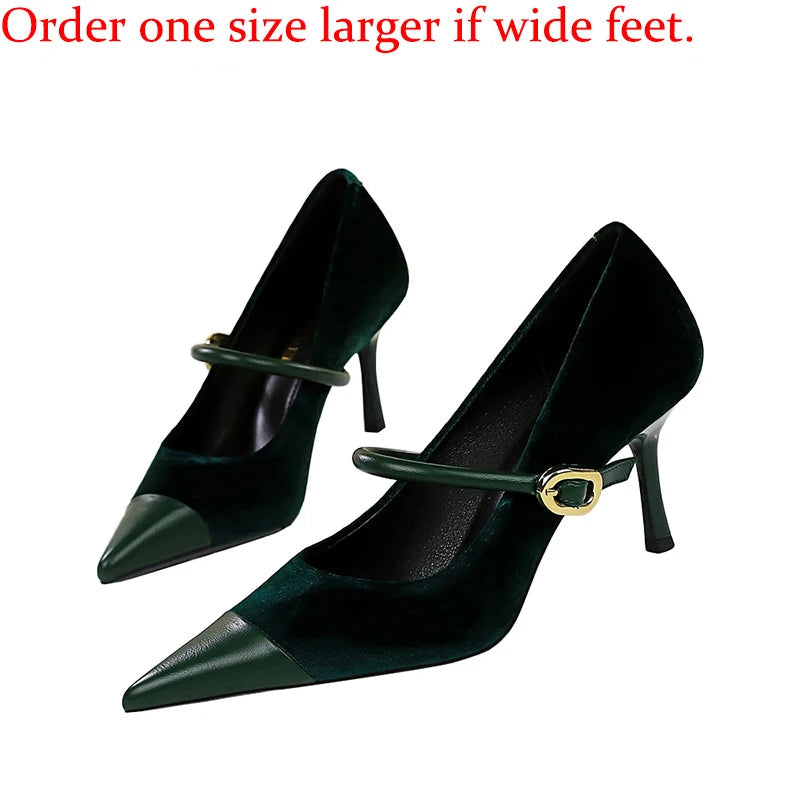 Pair of black high-heeled shoes with a strap on a white background