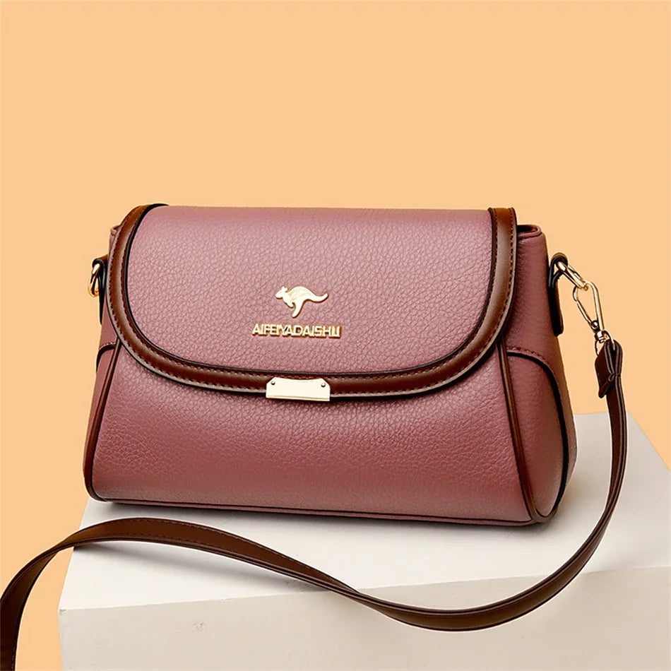 Purple handbag with a kangaroo logo on a beige background
