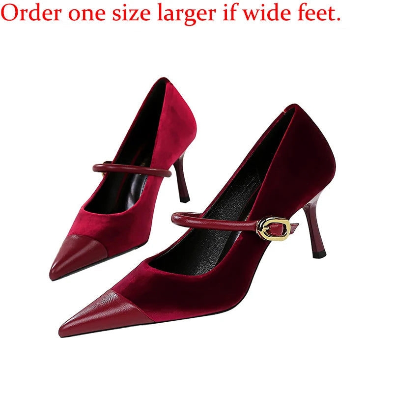 Red high-heeled shoes with a gold buckle on a white background, accompanied by text advising to order one size larger for wide feet.