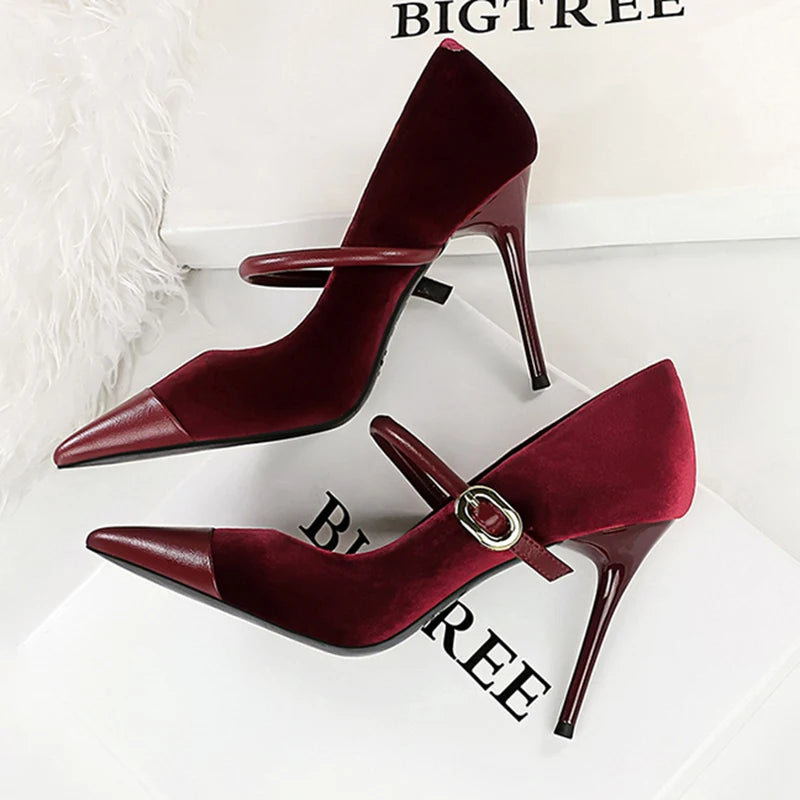 Burgundy high-heeled shoes with a strap on a white surface with 'BIGTREE' branding.
