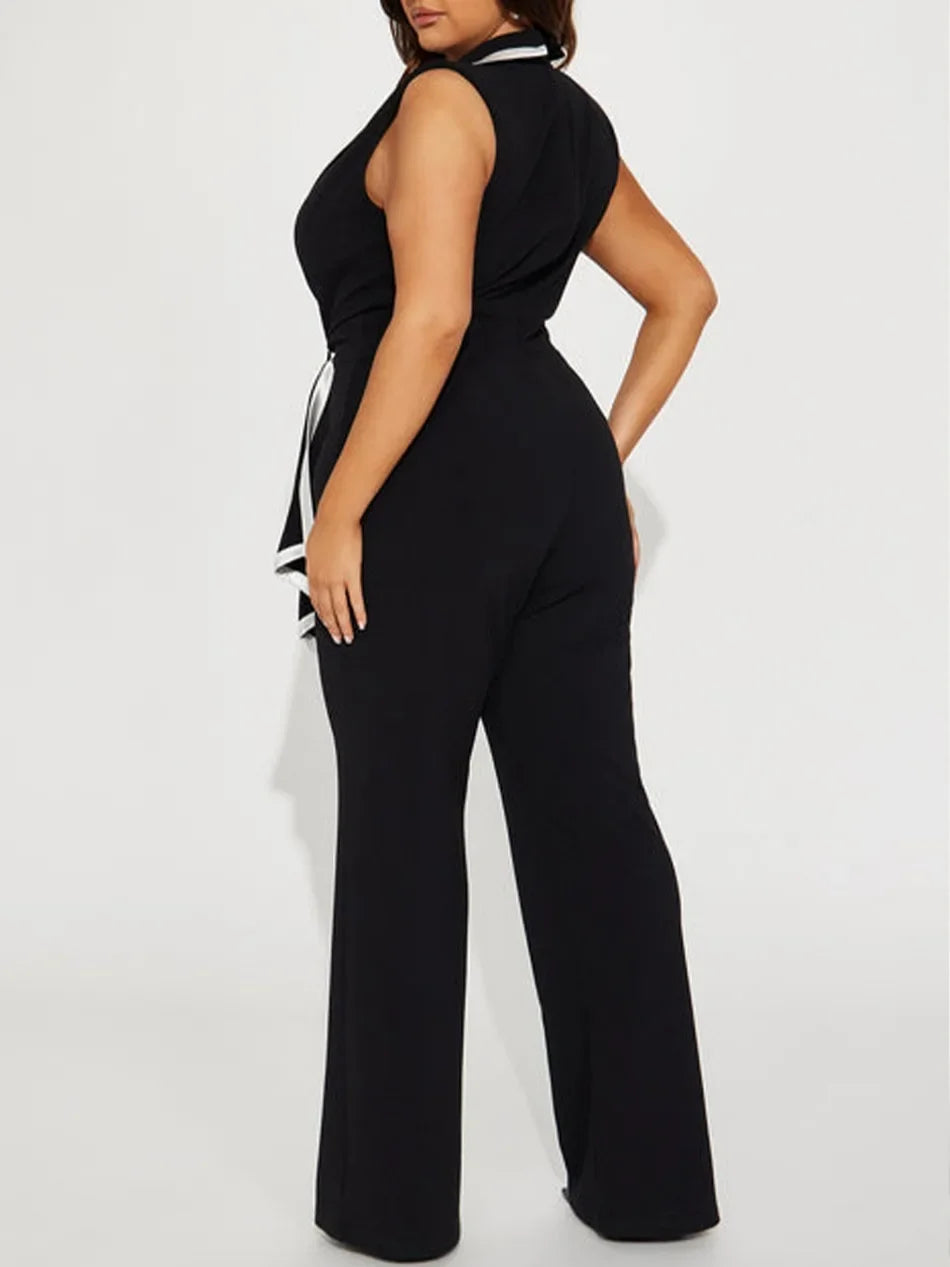 Black jumpsuit worn by a model on a white background