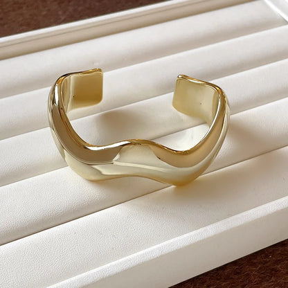 Gold bracelet on a white jewelry display box