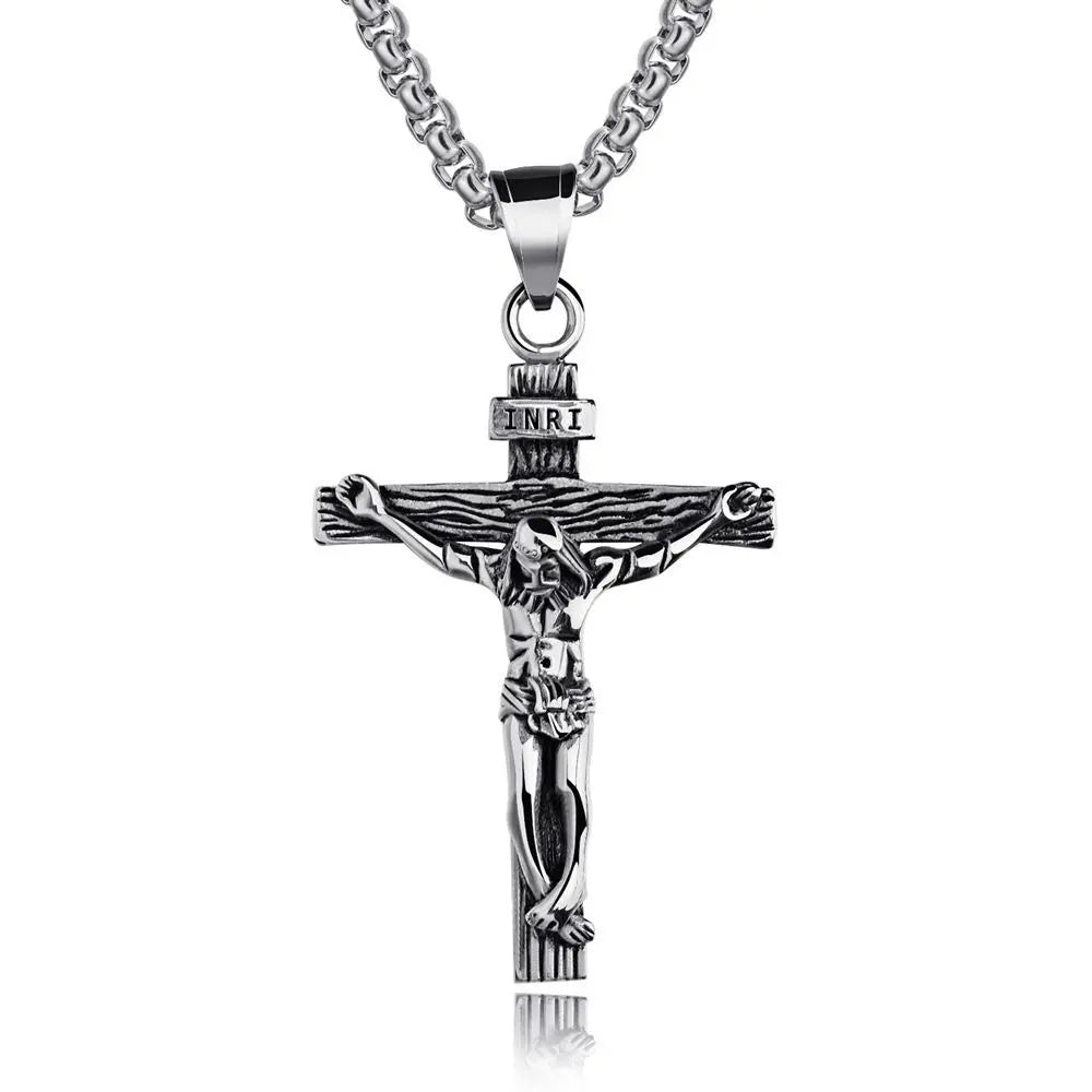 Silver crucifix pendant necklace on a white background