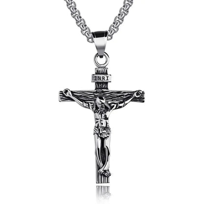 Silver crucifix pendant necklace on a white background