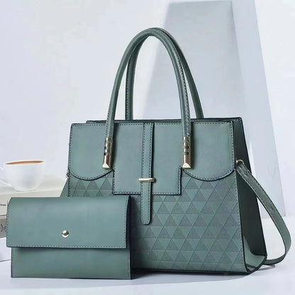 Green handbag with matching wallet on a light gray background