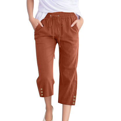 Brown capri pants with drawstring waist and button details on a white background