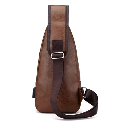 Brown leather sling bag with a strap on a white background