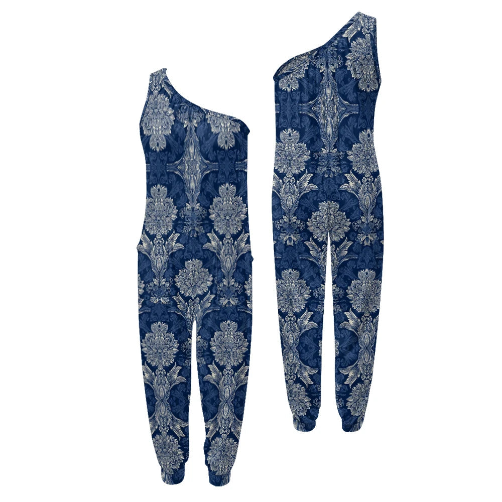 Blue floral one-shoulder jumpsuit on a white background.