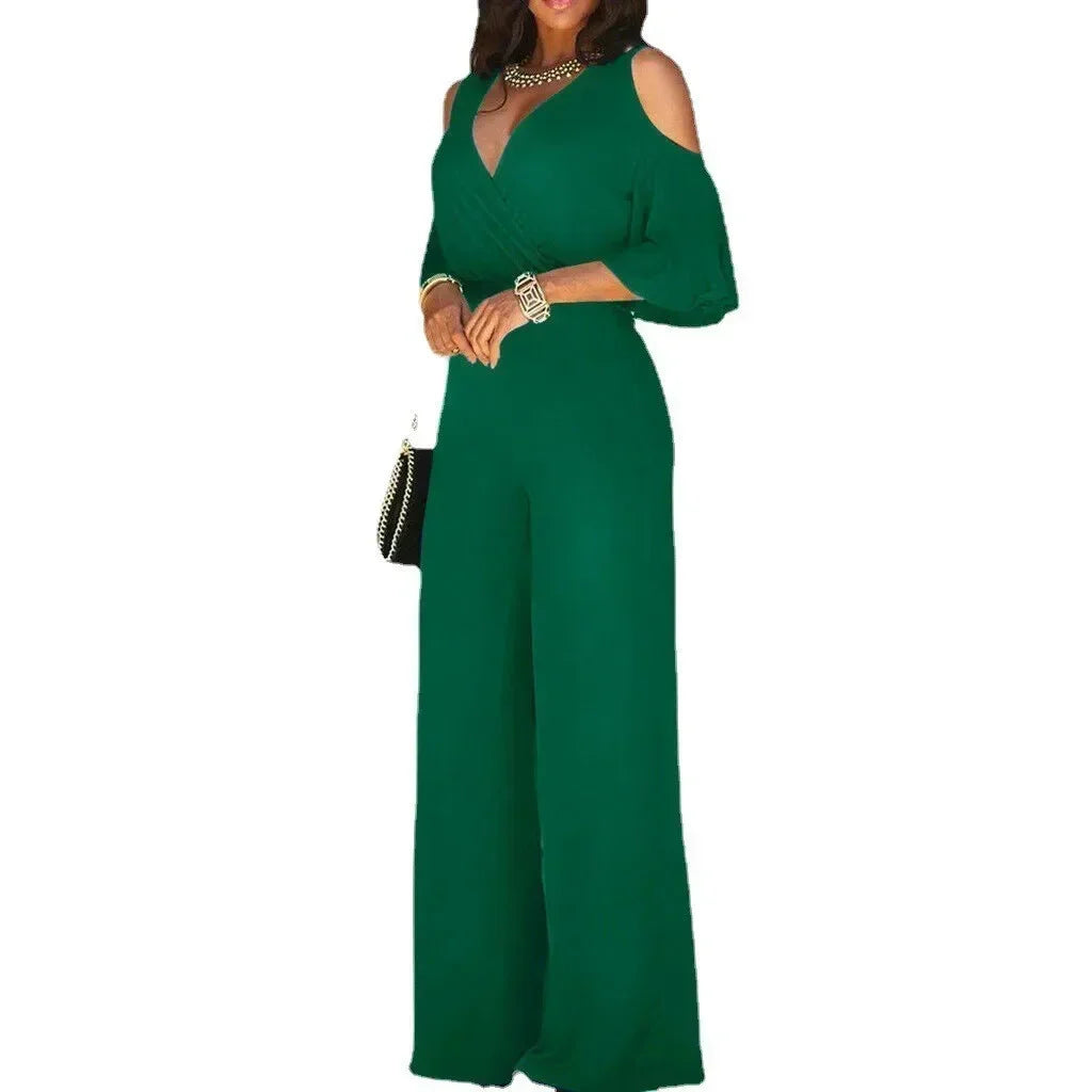 Green evening gown with cut-out shoulders on a white background