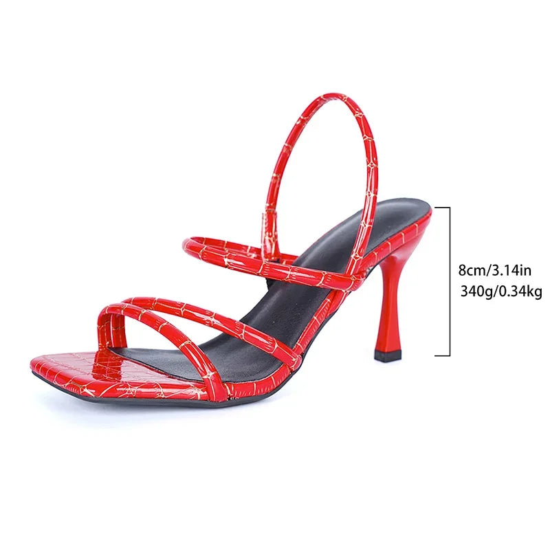 Red high-heeled sandal with measurements on a white background