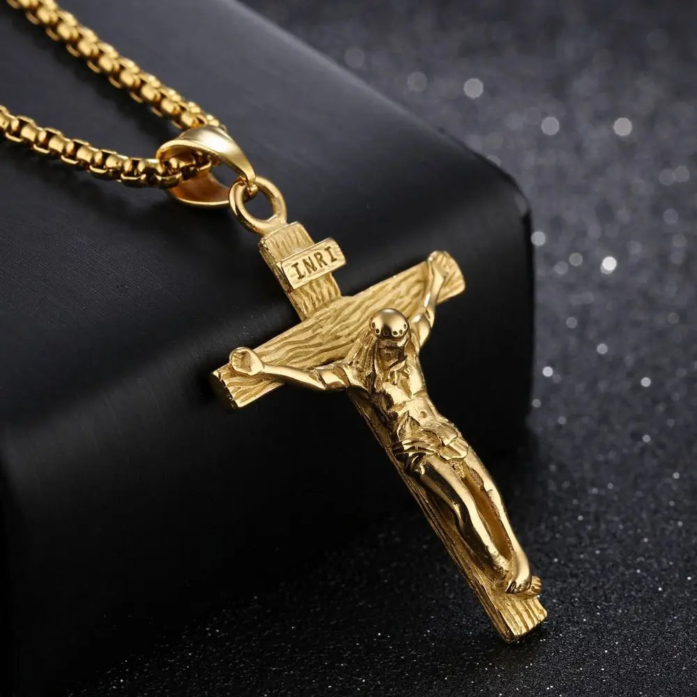 Gold crucifix pendant on a black background