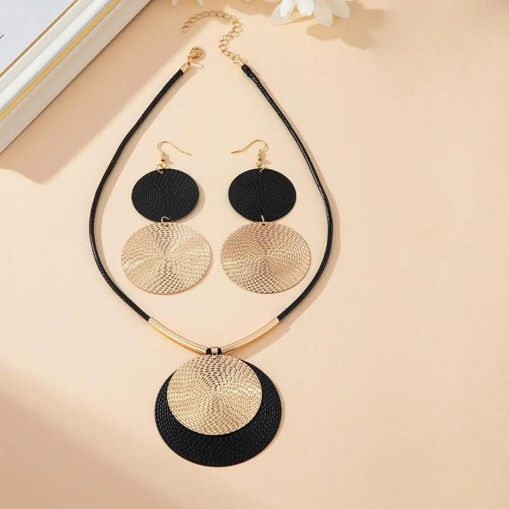 Jewelry set with necklace and earrings on a beige background
