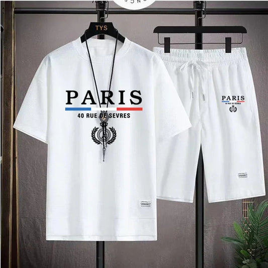 White t-shirt and shorts set with 'PARIS' text on hangers against a gray background.