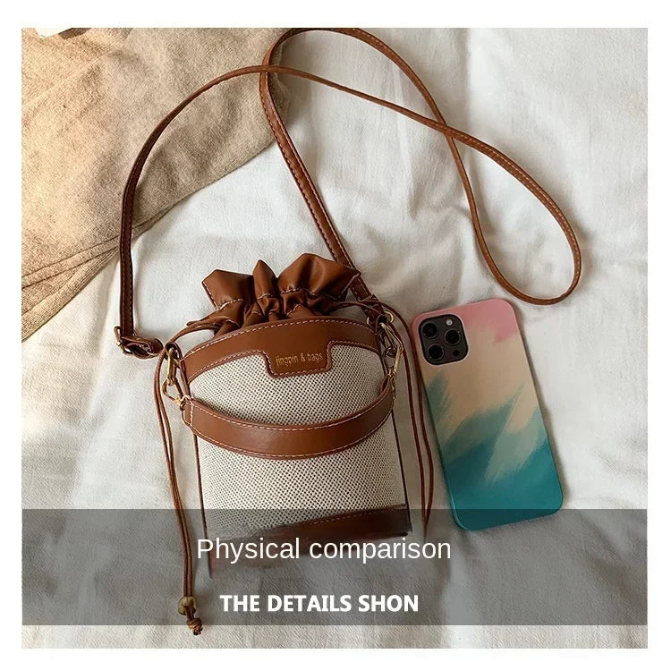 Brown drawstring bag and phone with gradient case on a white surface