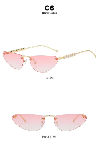 Pink sunglasses with gold frames on a white background
