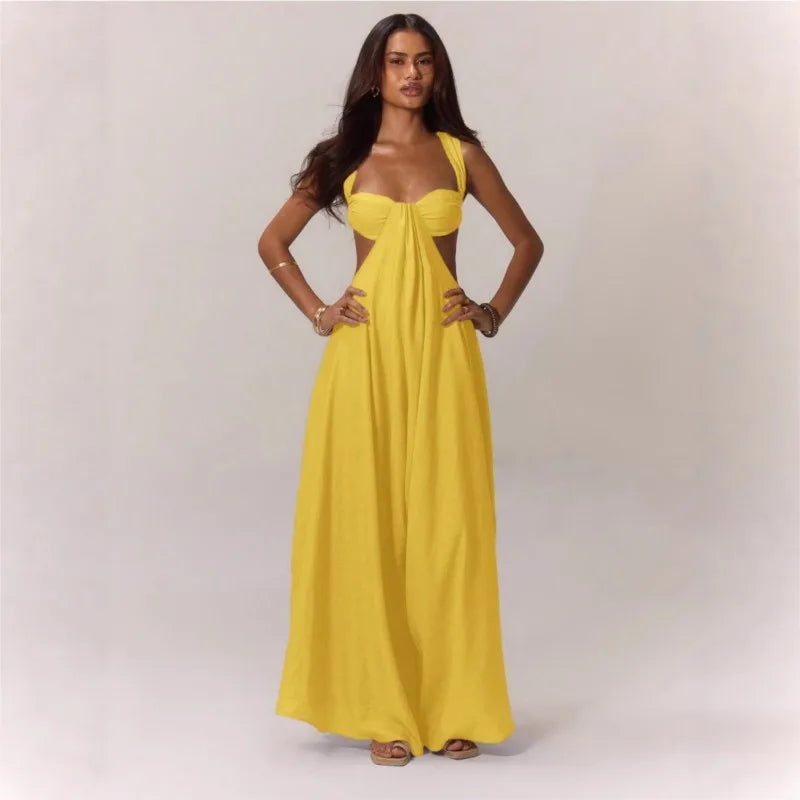 Woman wearing a yellow dress against a plain background