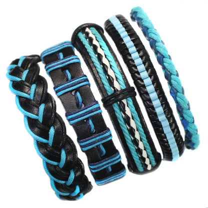 Set of braided bracelets with black, blue, and white pattern on a white background