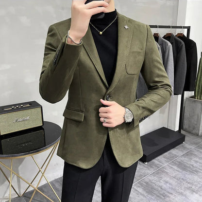 Person wearing an olive green blazer in a clothing store setting