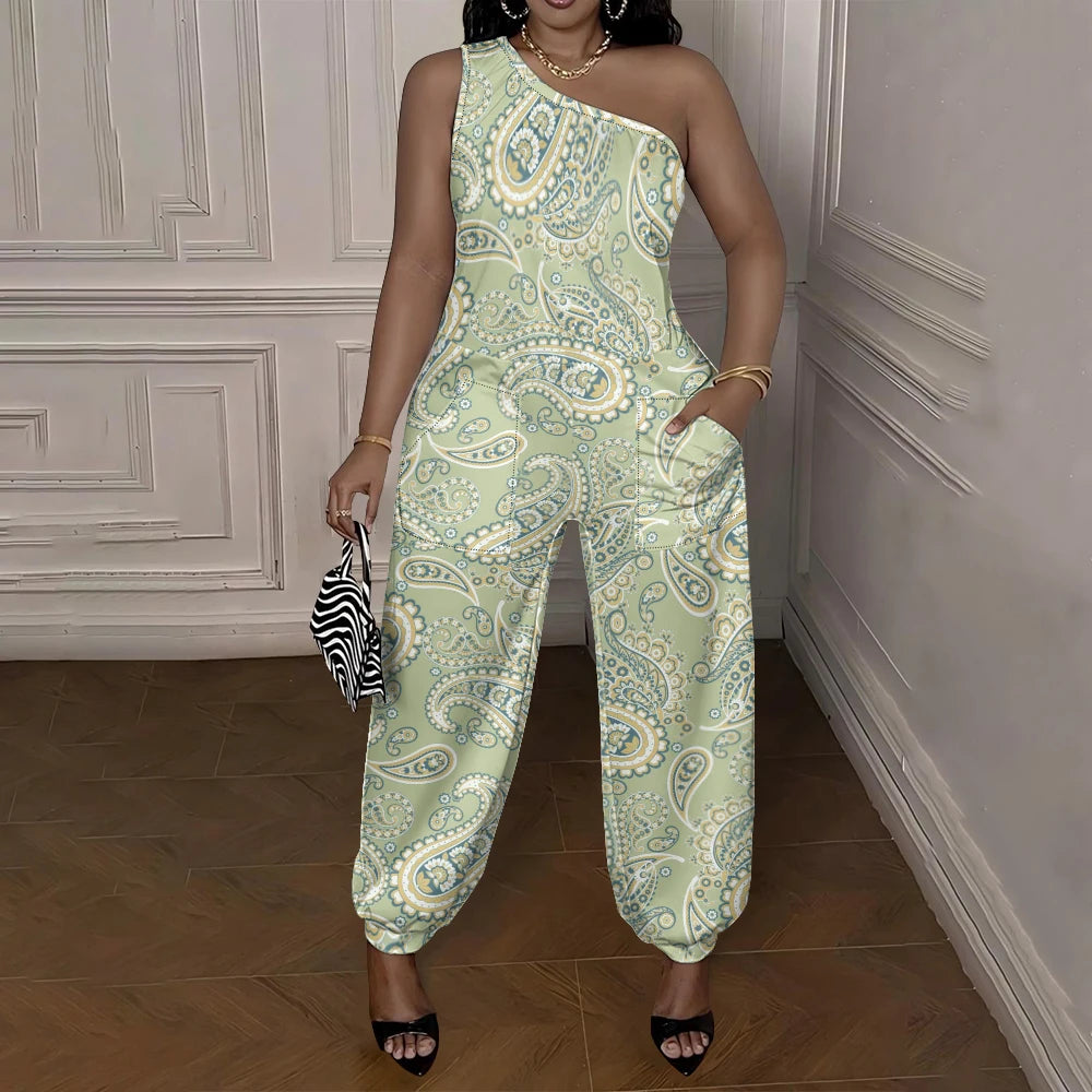Woman wearing a green paisley jumpsuit in an elegant room.