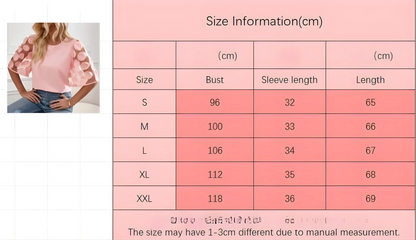 Size chart for a pink blouse with a model wearing it on the left.