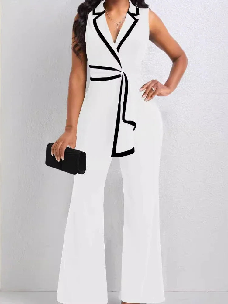 White jumpsuit with black accents worn by a person on a white background