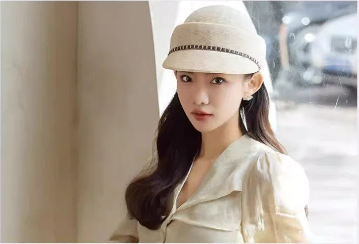 Woman wearing a white cap with text about street photography and fashion design.