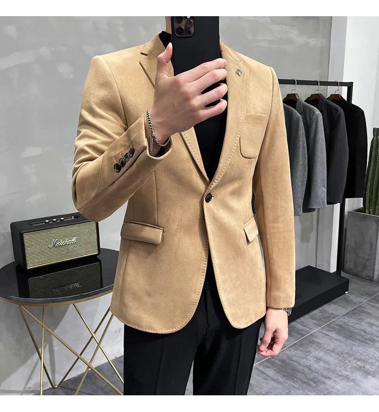 Beige blazer worn by a person in a clothing store setting
