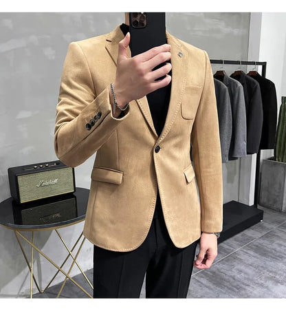 Beige blazer worn by a person in a clothing store setting