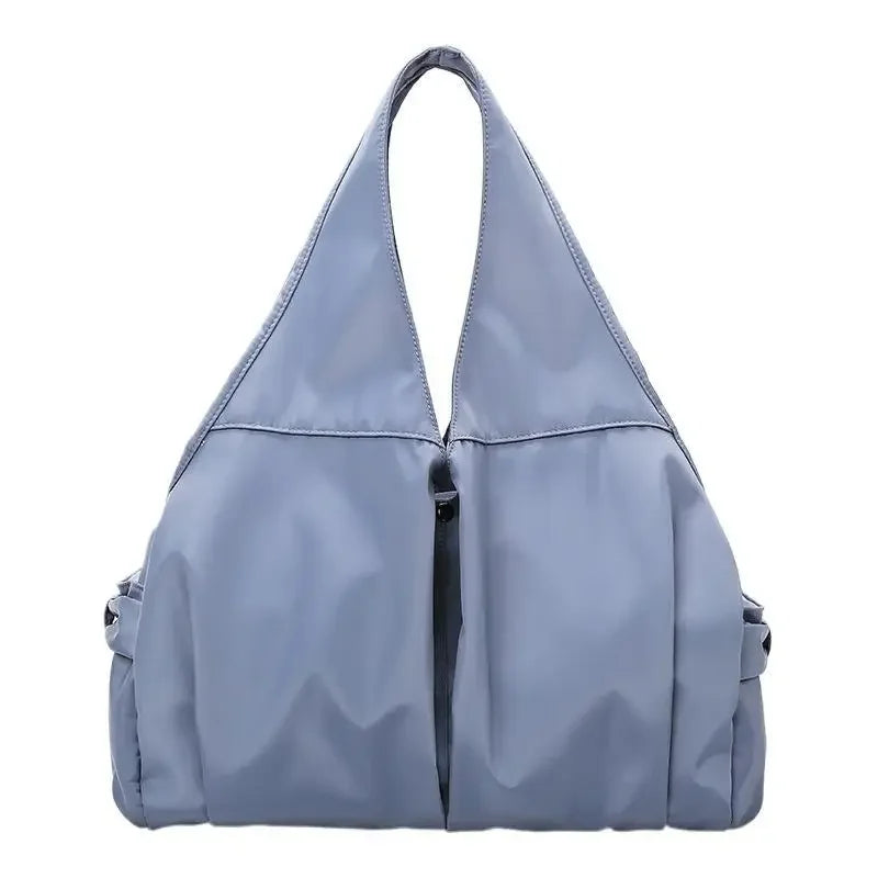 Light blue handbag on a white background